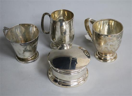 Three silver christening mugs and a silver powder pot.